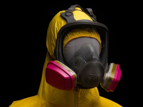 yellow Tyvek suit and gas mask