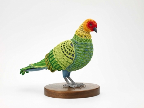 brightly colored woven sculpture of bird