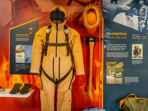Museum exhibit display of gear used for fighting fires by sky
