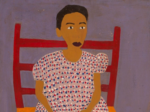 Image: A young African-American girl sitting in a red chair. Text: Grades PK–1