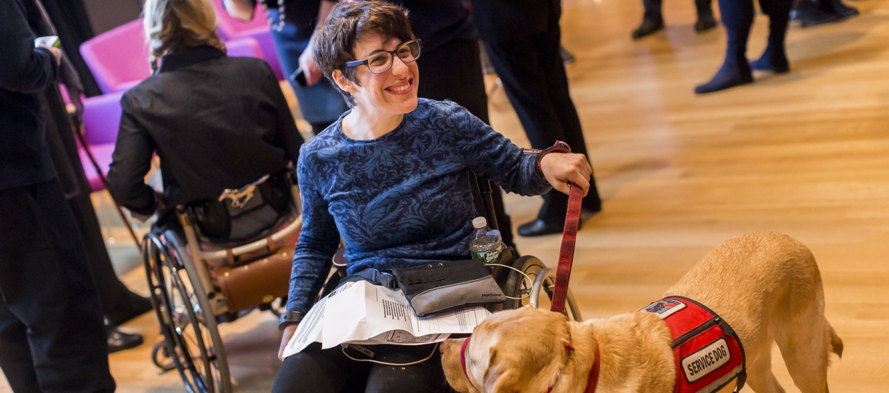 participant with service dog at Cooper Hewitt Lab: Design Access symposium photo by Scott Rudd