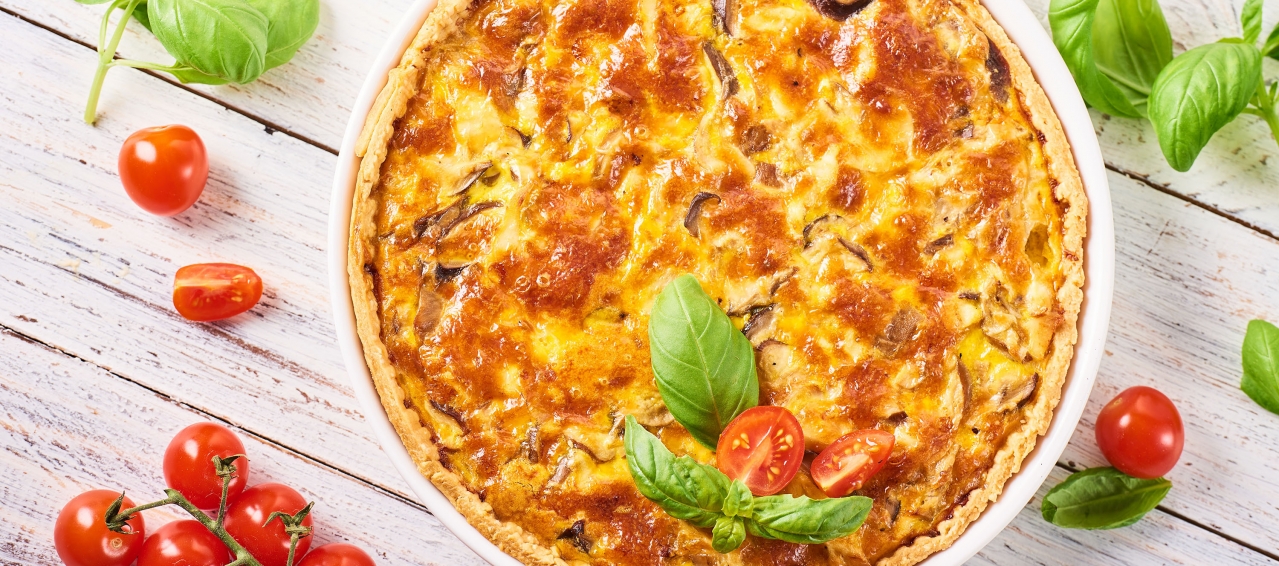 quiche with fresh tomatoes and basil