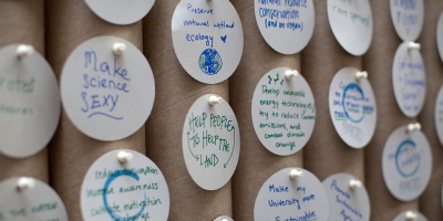 A wall of optimistic messages from an Earth Optimism Summit.