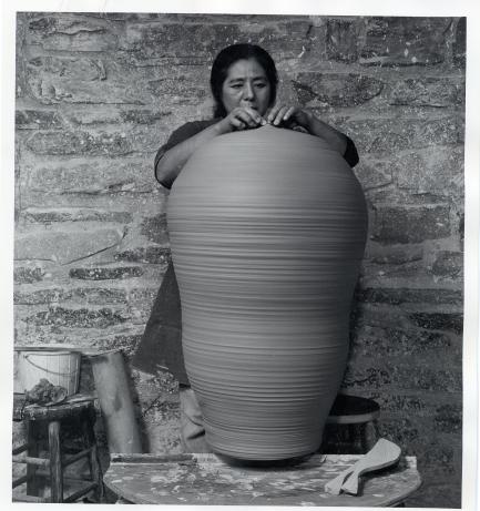 Woman with clay pot