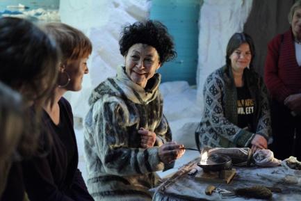 Still from film Angry Inuk showing group of women talking