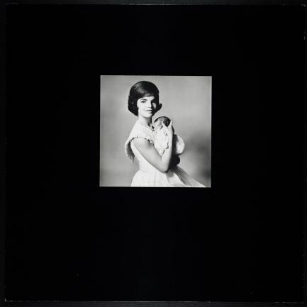 Black and White photo of Jacqueline Kennedy holding infant John
