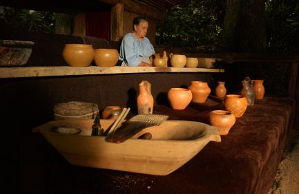 A potter with traditional Cherokee pottery