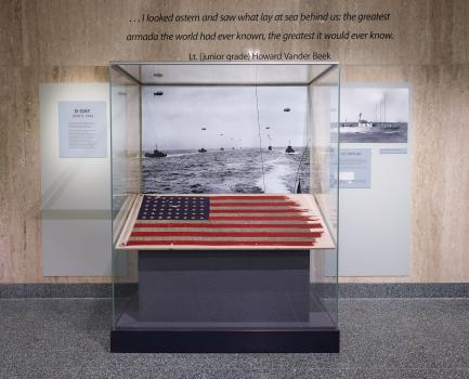 Tattered American flag in display case