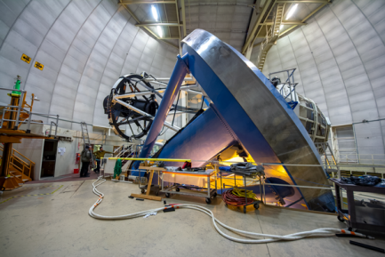 Large astronomy technology being installed at a telescope 