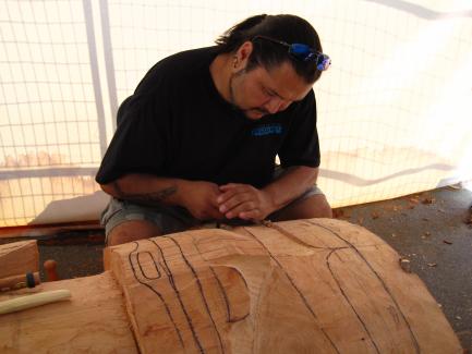 Mike Dangeli carving a mask