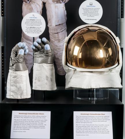 Exhibit display of gloves and helmet