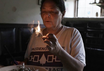Woman lighting a candle