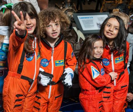 Young girls in astronaut uniforms