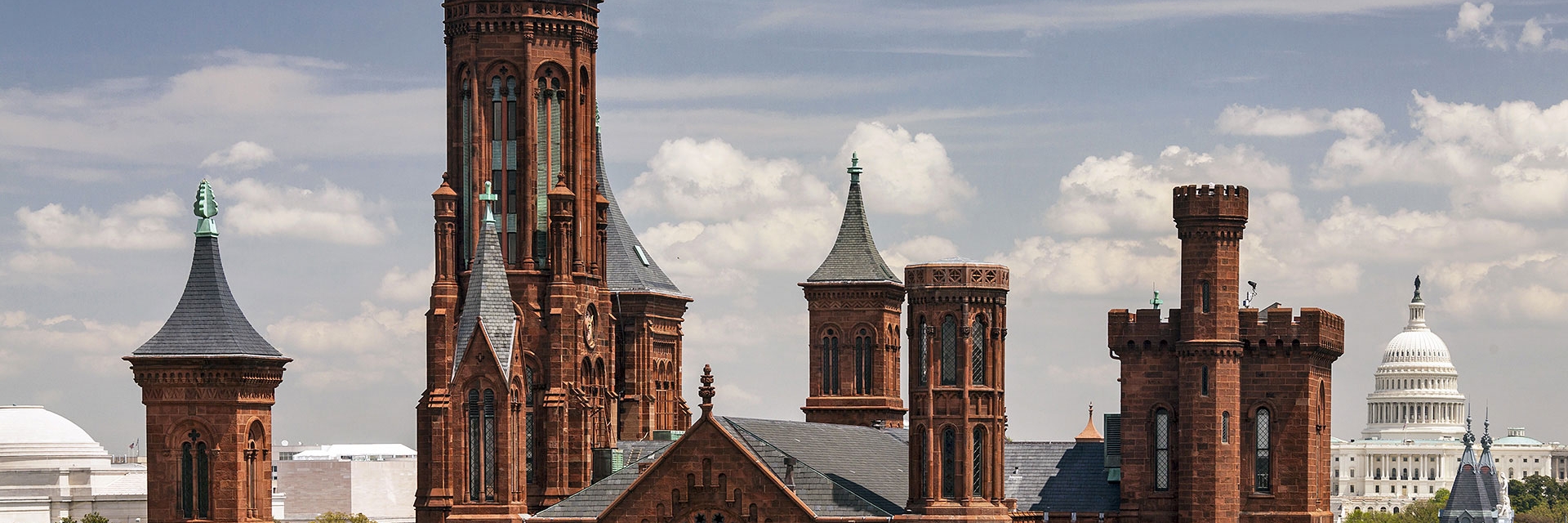 Image of the Smithsonian Institution Castle with the U.S. Capitol in the background