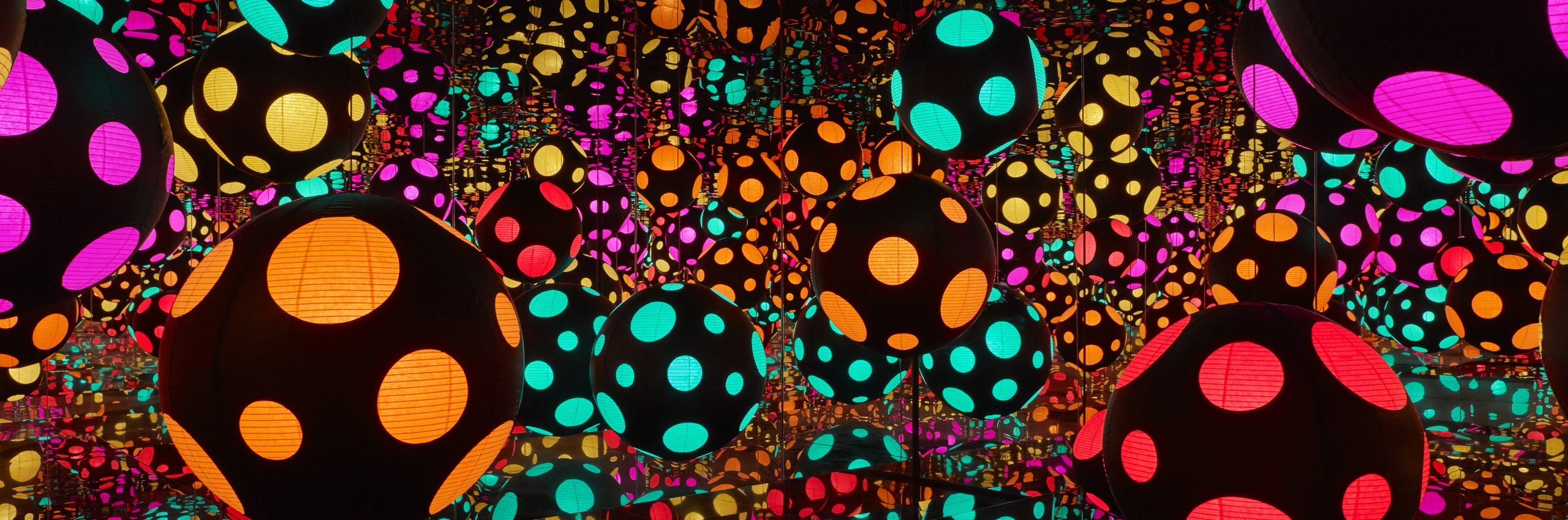 infinity room with colorful dotted orbs