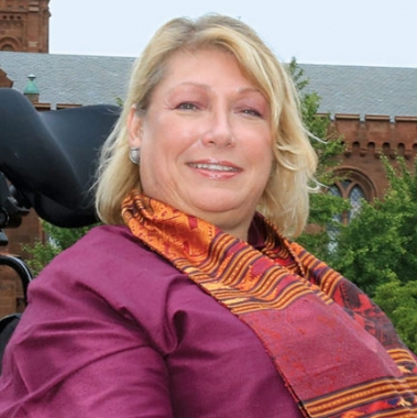 Beth Ziebarth in front of the Smithsonian Castle