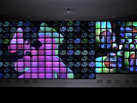 View of bank of video monitors displaying artwork "Megatron/Matrix"